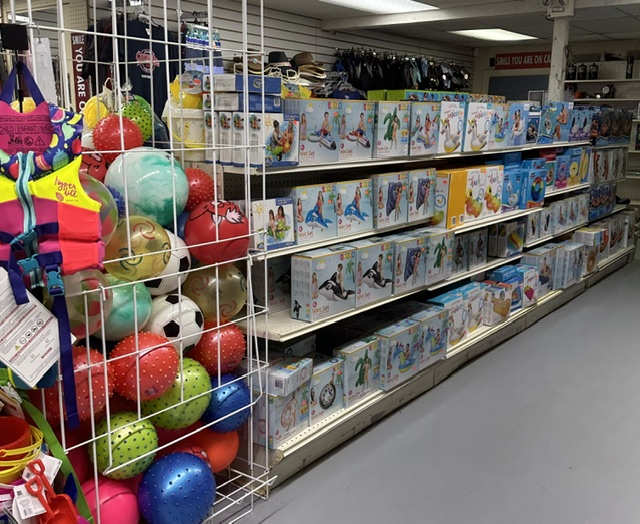 Beach balls, life jackets and inflatable pool float boxes lining the aisle at Bayview
